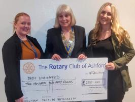 Heidi Young and Gemma Lawson from Dads Unlimited are presented with a cheque 
by Rotary President, Renate
